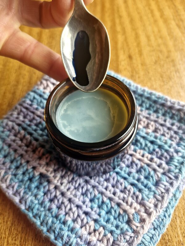 Tallow Balm - Blue Tansy - showing off the beautiful blue colour of blue tansy above Blue Tansy tallow balm, handmade in New Zealand by Fatglow