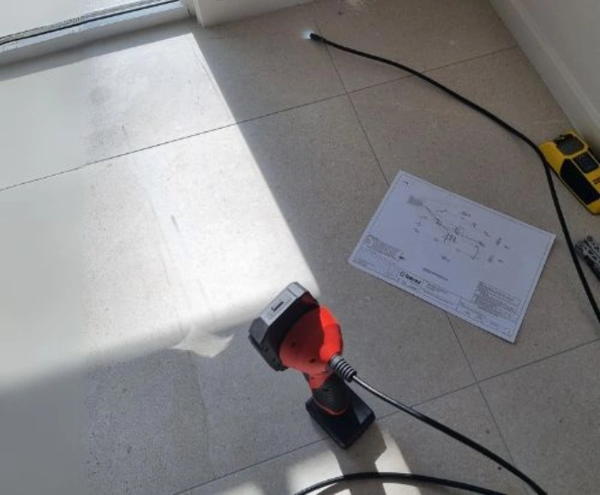 Structural inspection equipment set on a tiled floor