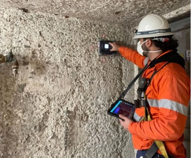 Technician scanning a concrete wall - SureScan concrete scanning services - Brisbane & Adelaide