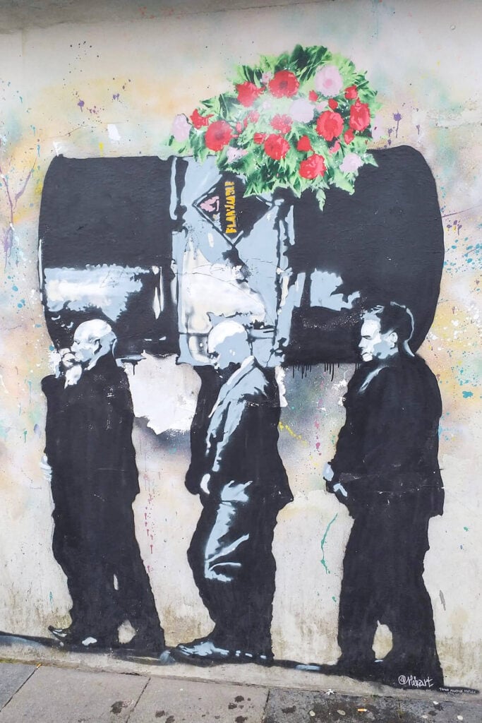 Stavanger street art - 3 men carrying a barrel