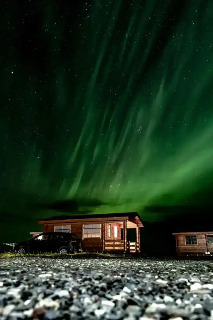 A remote cabin in the north of Iceland underneath the Northern Lights