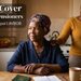Elderly South African grandmother reviewing funeral cover documents at home with her daughter