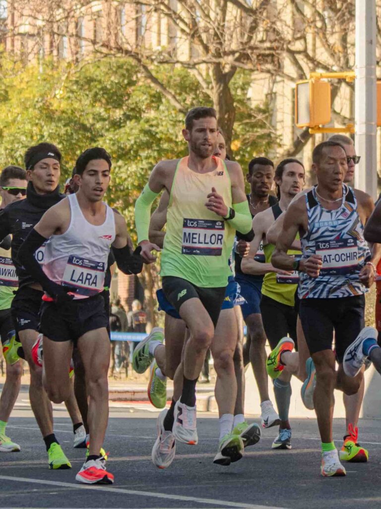 A photograph of Jonny Mellor running in a pack