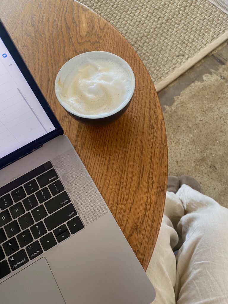 article banner featuring aerial view of laptop and coffee on table, working in a cafe.