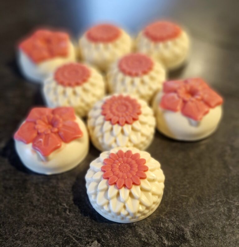 Cream tallow soaps NZ with coral dahlia and wild rose tops, layered petal detail, handmade by Fatglow