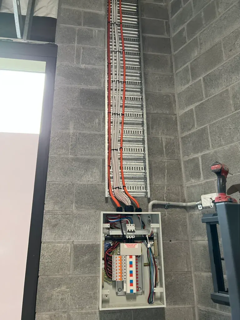 Modern electrical switchboard installation with cable tray in a commercial Sydney building