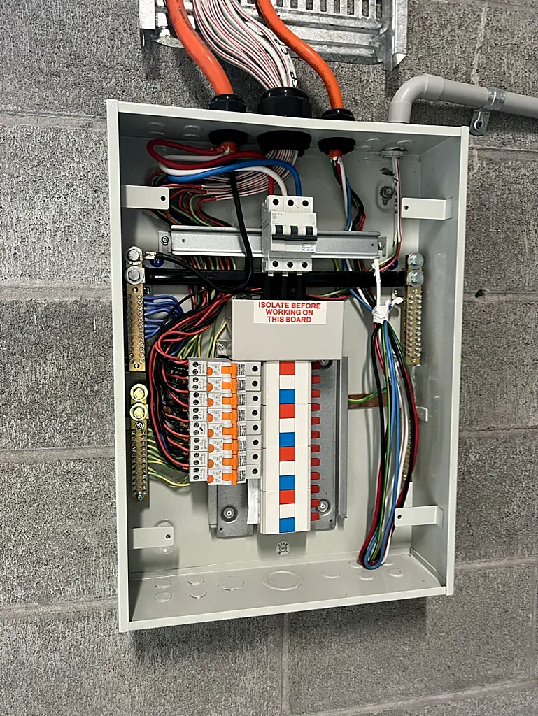 New indoor switchboard with RCBO circuit breakers per circuit and isolation label, Bondi switchboard upgrade by SRS Services