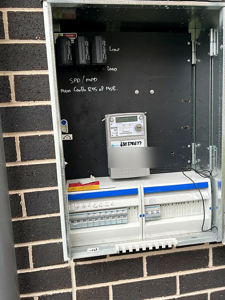 Digital smart meter with 3-phase SPD/MPD fuses and RCBO distribution bank installed by SRS Services in Surry Hills