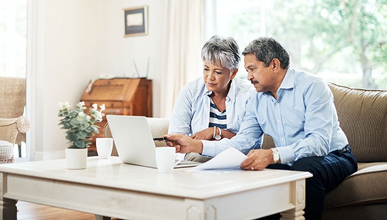 An elderly couple reviewing documents