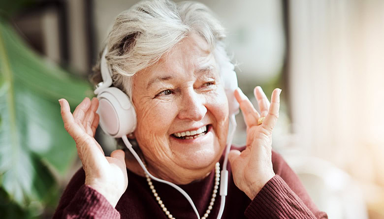 Senior woman listening to music