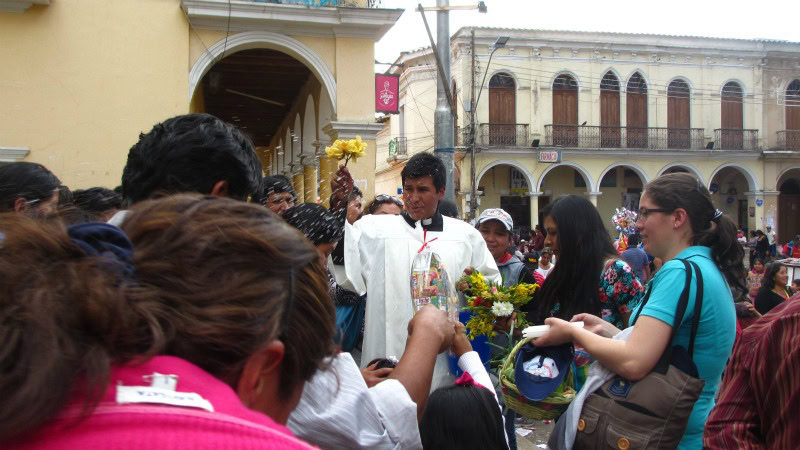 Priest blessing with holey water