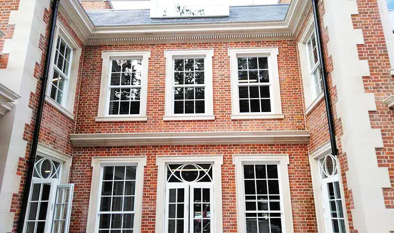 white framed windows installed at 87 avenue