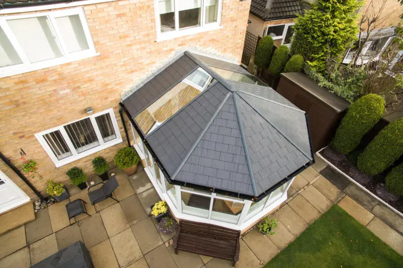 UltraRoof 380 tiled conservatory roof replacement photographed from above showing grey slate-effect tiles and glazed panel on a Victorian conservatory in Berkshire
