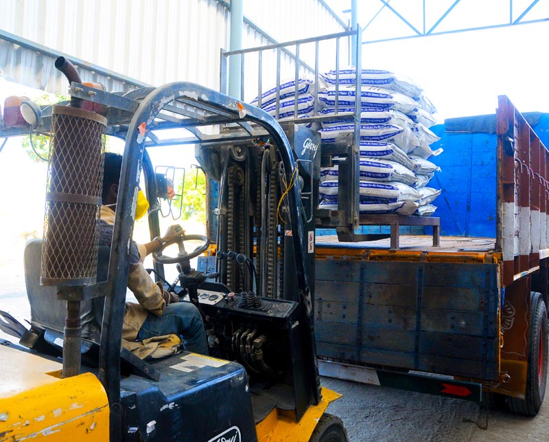 Forklift loading Ideal Drymix plaster bags onto delivery truck