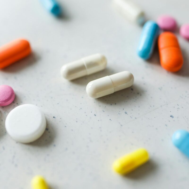 article banner of various supplements and pills on a table.