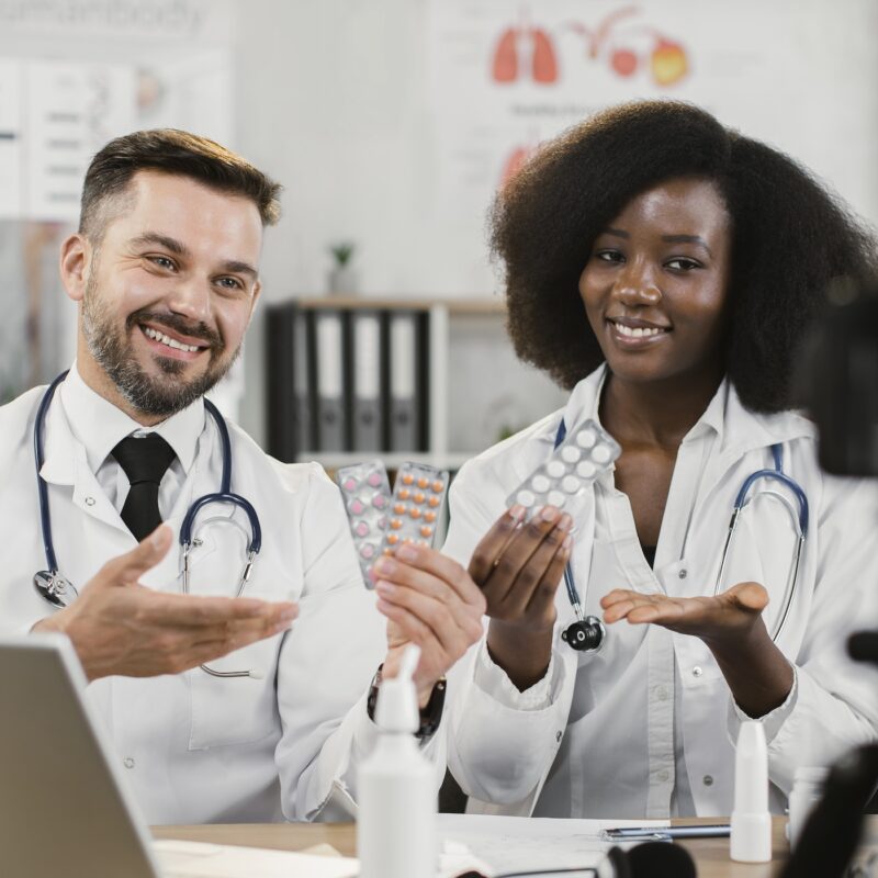 article banner image featuring two doctors sitting in front of a camera