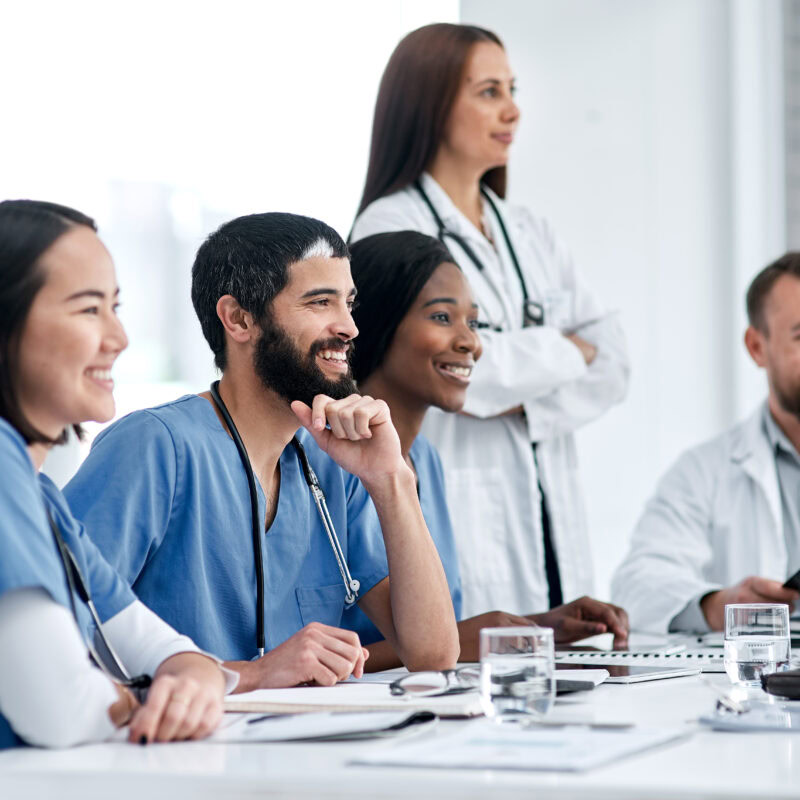 article banner featuring stock photo of a group of healthcare providers smiling