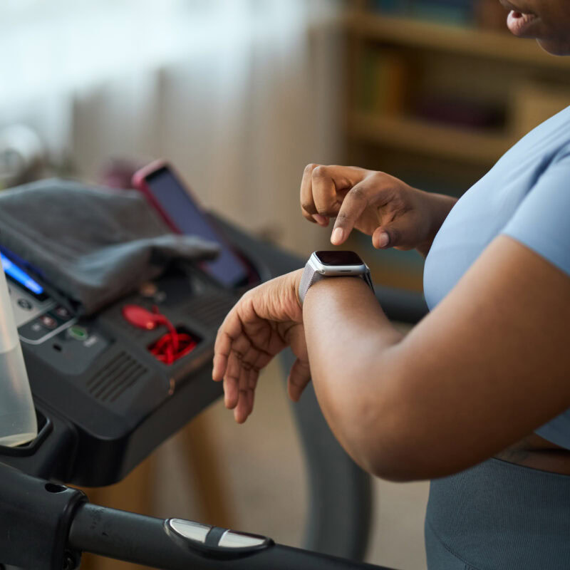 Marketing Complex Medical Devices To Women article banner featuring a woman using a smartwatch
