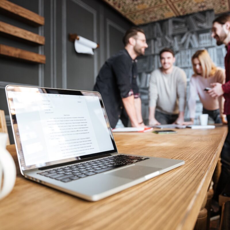How to Choose a Healthcare Marketing Agency article banner featuring a laptop and group of people