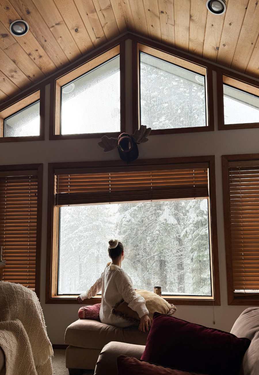 Winter Holidays in the Italian Alps , by the cabin window