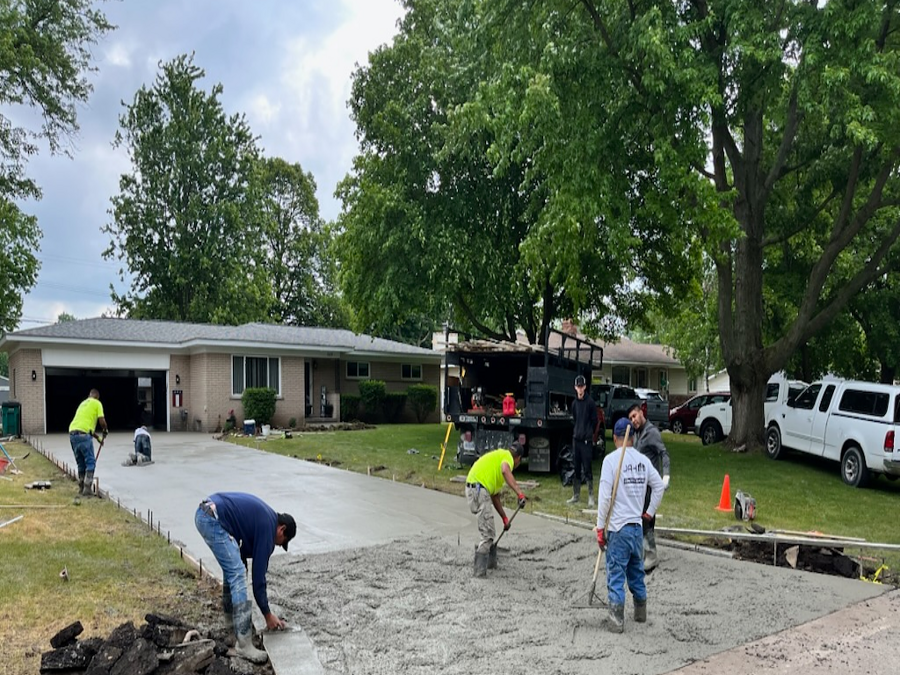 Hubble Contracting crew completing a concrete project in Oakland County