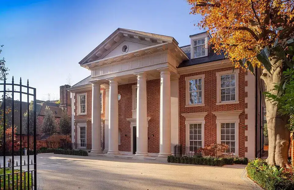 classic brick mansion with white pillars