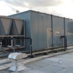Thumbnail of http://Large%20industrial%20HVAC%20unit%20on%20a%20rooftop%20with%20connected%20piping.