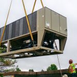 Thumbnail of http://A%20large%20industrial%20unit%20being%20lifted%20by%20cranes%20at%20a%20construction%20site.