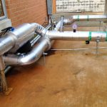 Thumbnail of http://Industrial%20pipes%20and%20valves%20installed%20on%20a%20concrete%20floor.
