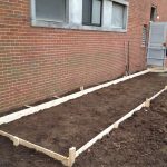 Thumbnail of http://Freshly%20prepared%20rectangular%20garden%20bed%20with%20wooden%20frame.