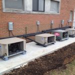Thumbnail of http://Row%20of%20outdoor%20HVAC%20units%20installed%20against%20a%20brick%20building.