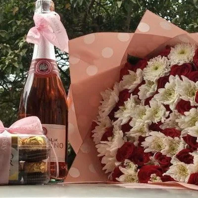 Shop at Nectar Flower Shop Nairobi, Kenya-combo bouquet with T16, Flagolino wine With red roses and wnithe chrysanthemums bouquet wrapped with love and care with pink wrrapping