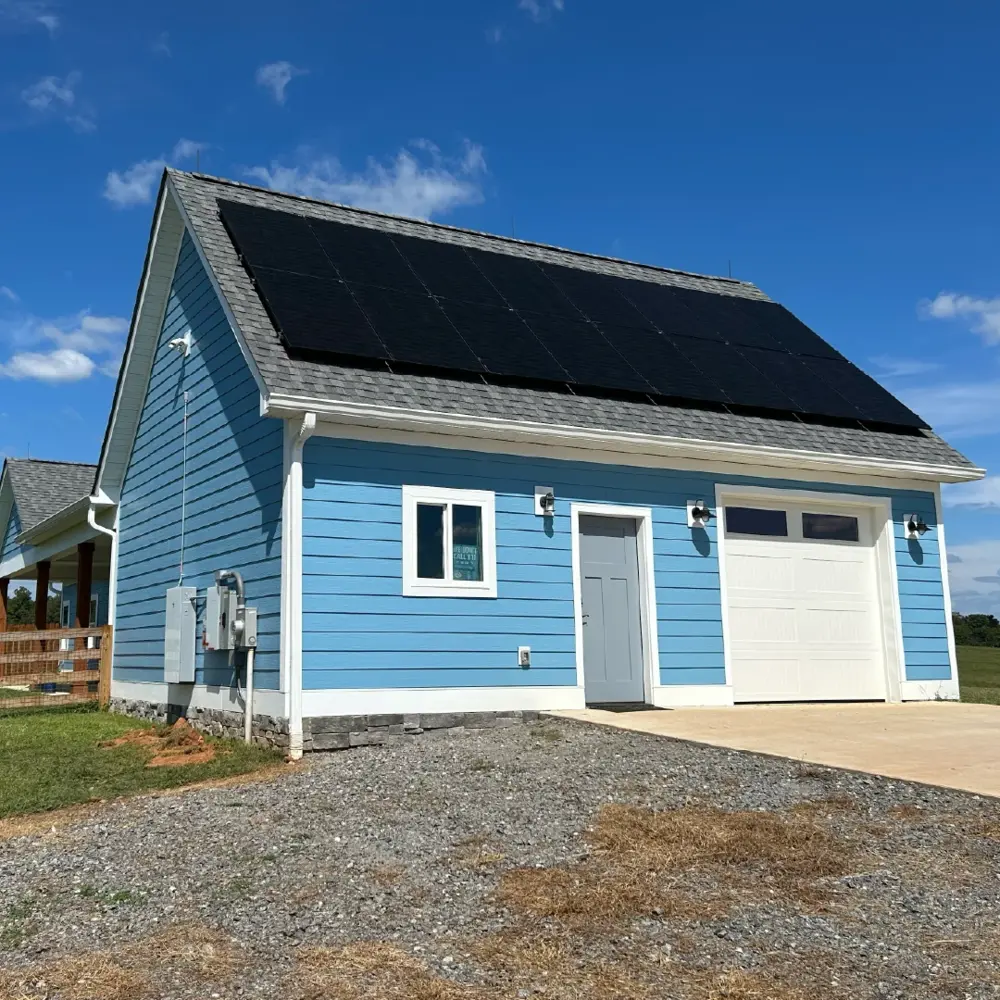blue garage with solar and battery