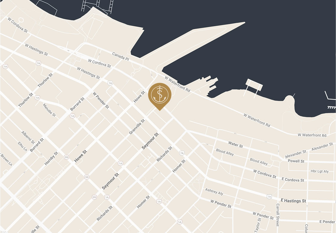 A map showing city streets near a waterfront, with a gold location marker featuring a dollar sign placed on West Waterfront Road near the water.
