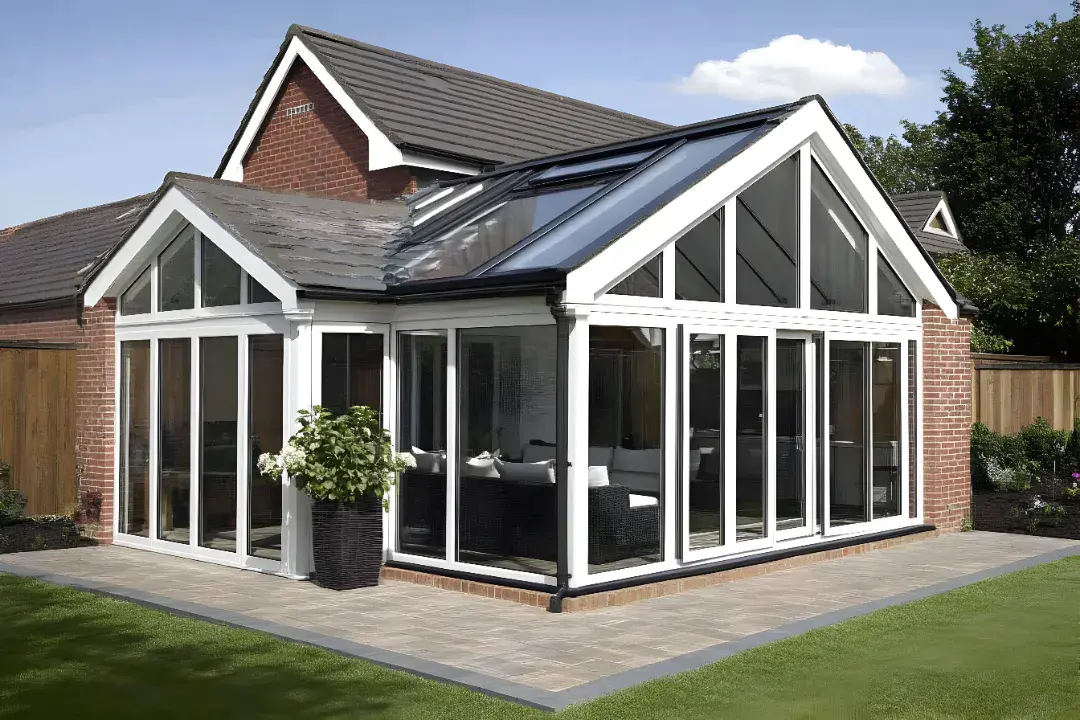 brick conservatory with multiple doors and windows