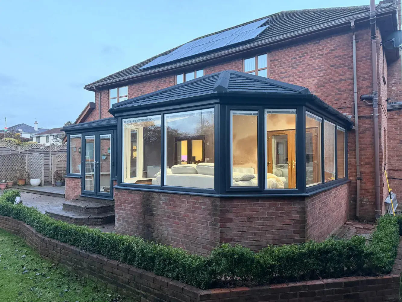 glass panels at brick conservatory