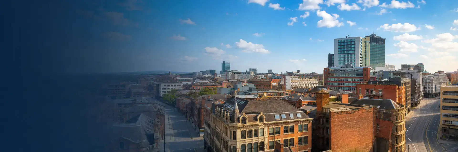 Home Improvements in Oldham banner showing traditional properties, modern buildings and the surrounding urban skyline on a sunny day.