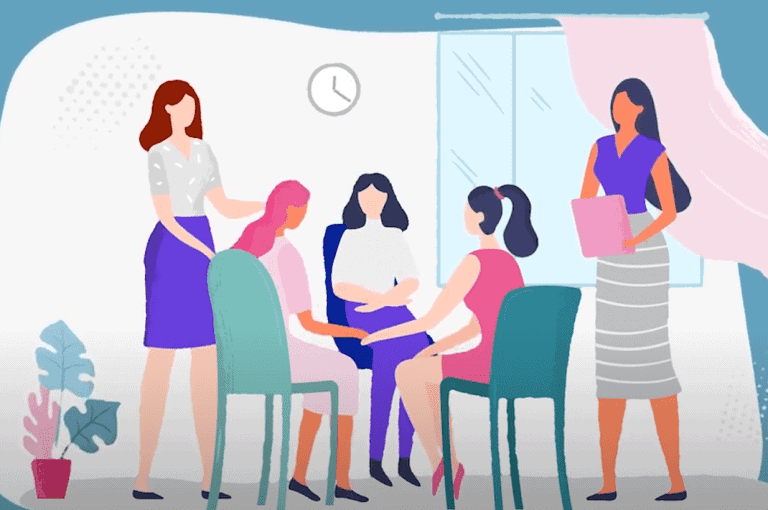 Illustration of five women in a room having a discussion, with some seated in a circle and others standing. A clock, window, curtains, and a potted plant are visible in the background.