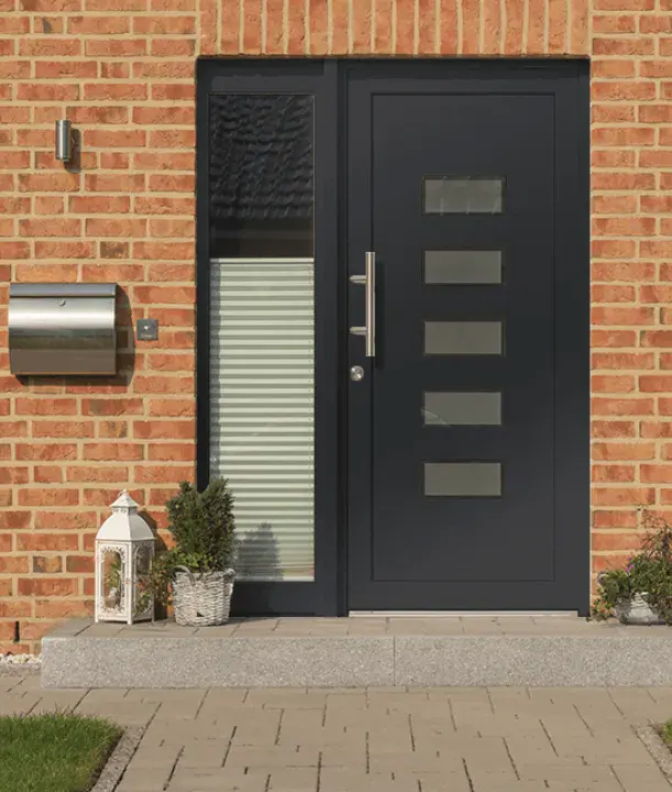 Hallmark black aluminium front door with horizontal glazing and side panel on brick house.