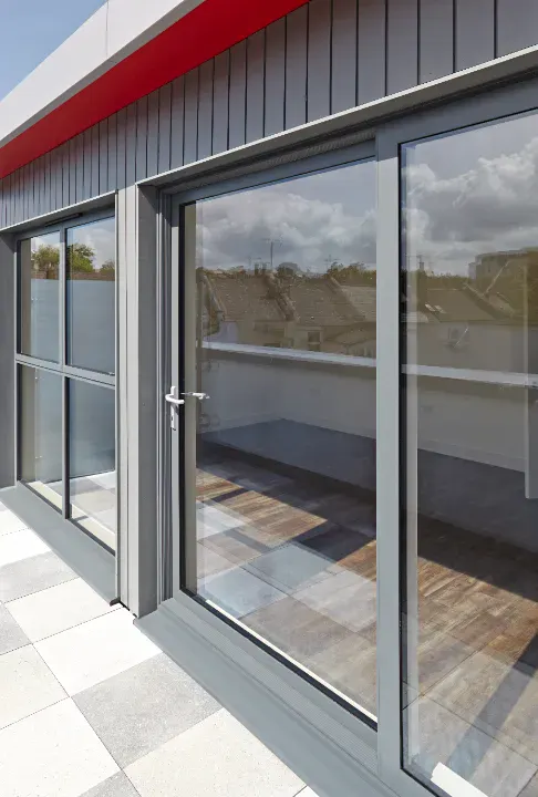 gray smart sliding aluminium doors opening onto modern balcony space