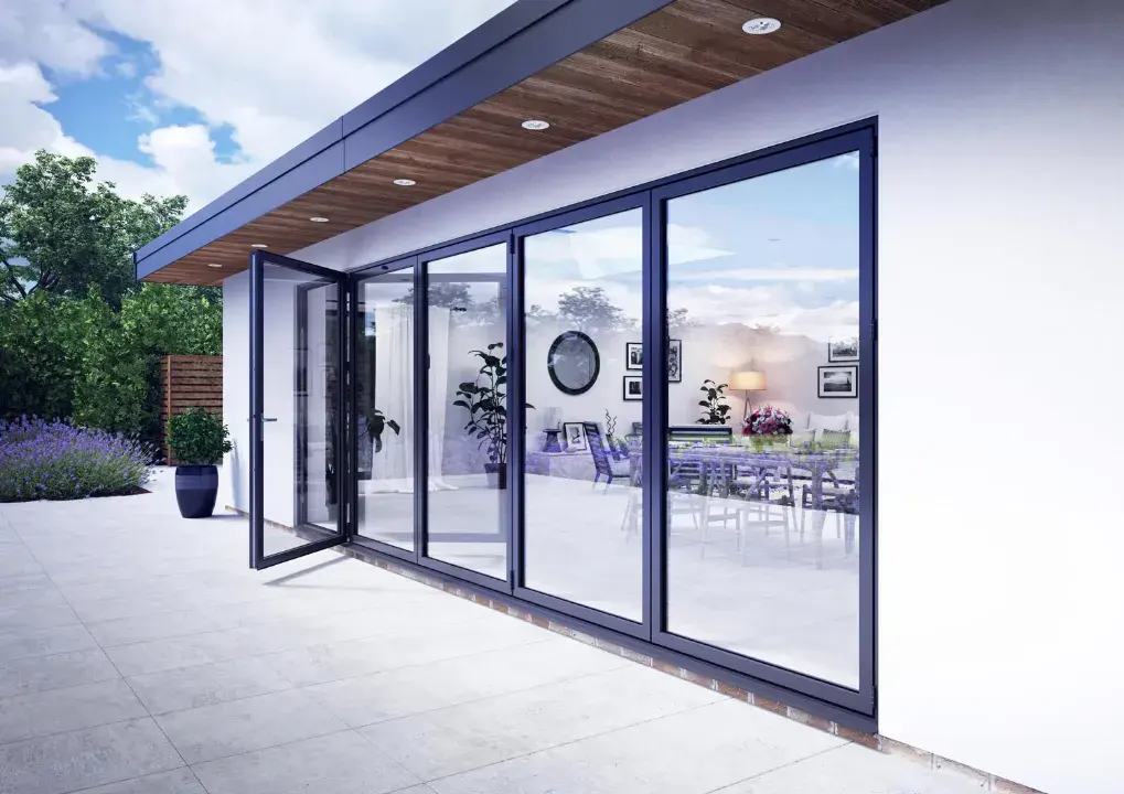 Grey aluminium sliding doors fitted to a modern rear extension