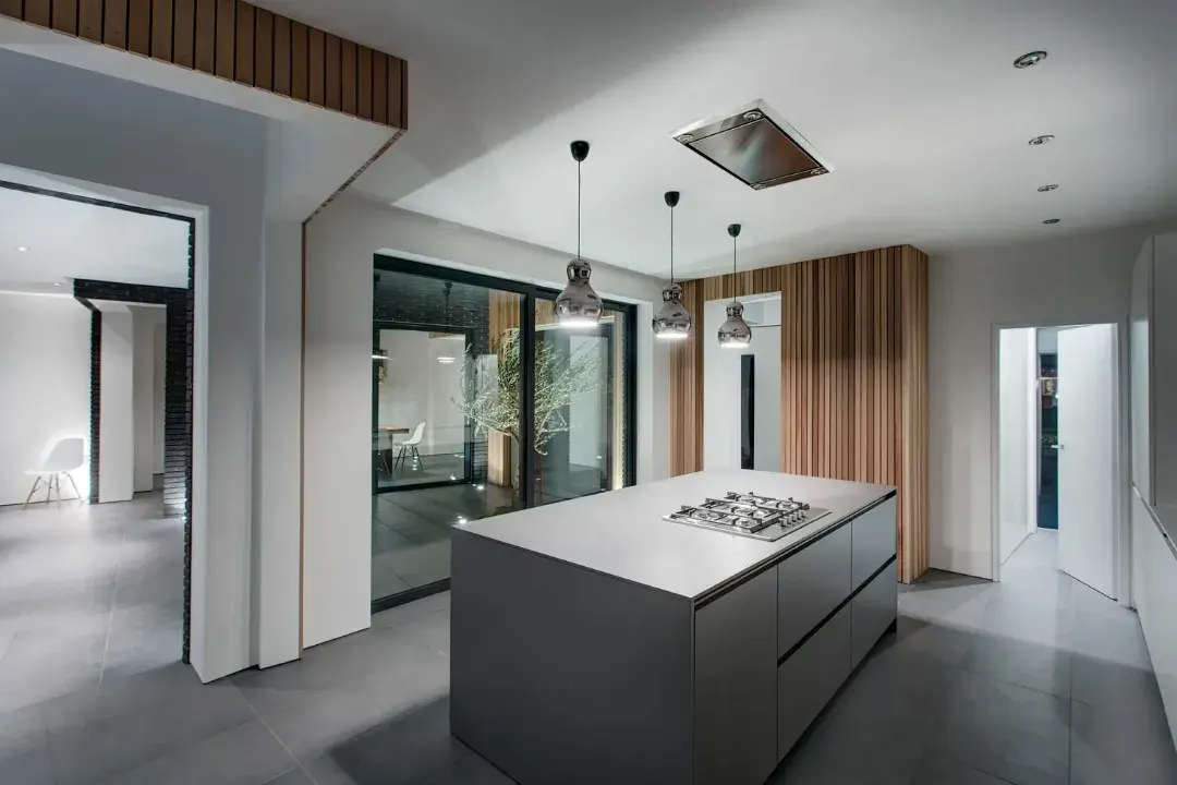 Black aluminium sliding patio doors fitted beside a modern kitchen