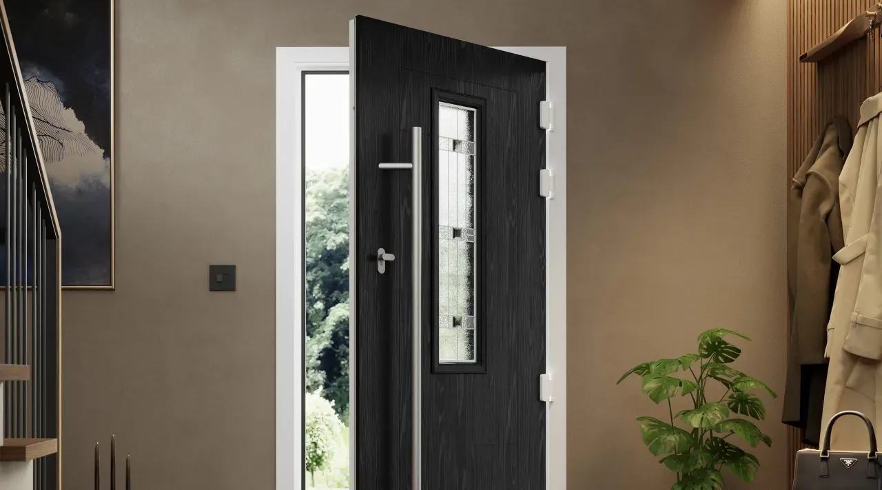 Black composite front door with decorative glazing and a long pull handle