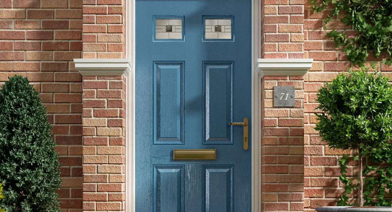 Blue composite front door with decorative glazing and brass hardware