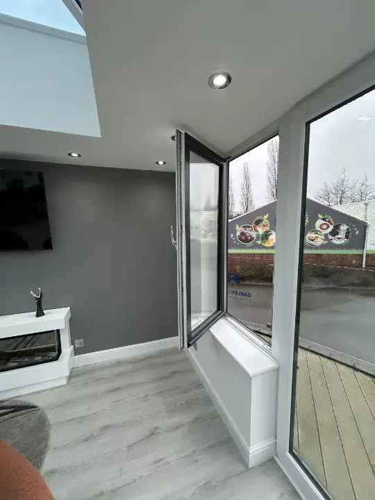 Interior view of an open white uPVC tilt and turn window