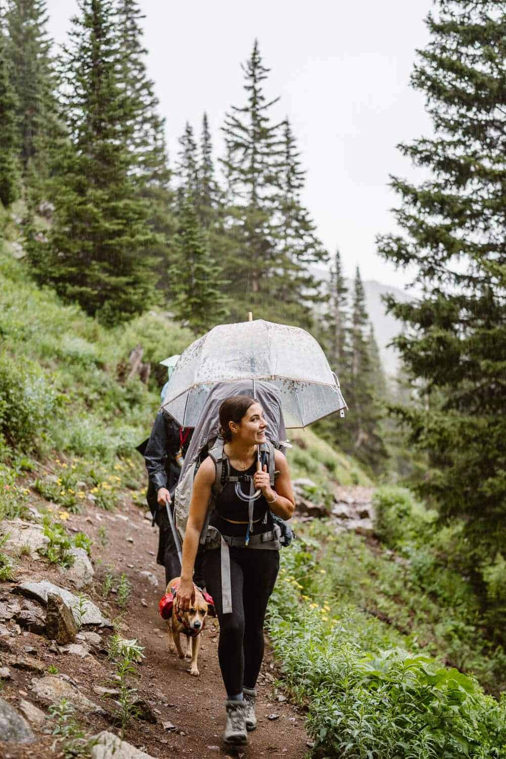 Bride and Groom Hiking in the Rain Colorado Mountain Elopement Packages