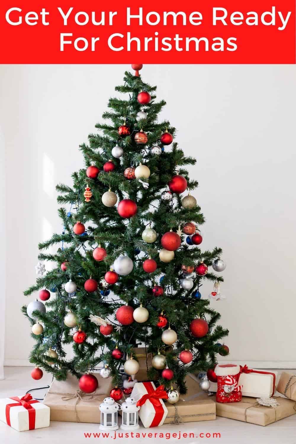 A closeup of a Christmas tree decorated with red and silver baubles