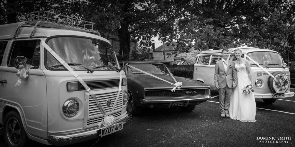 Bride and Groom with the wedding VW Campervans