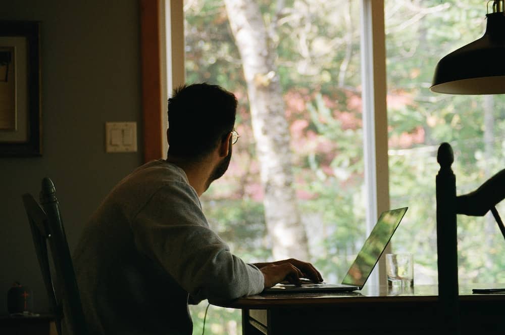  A man staring out the window.