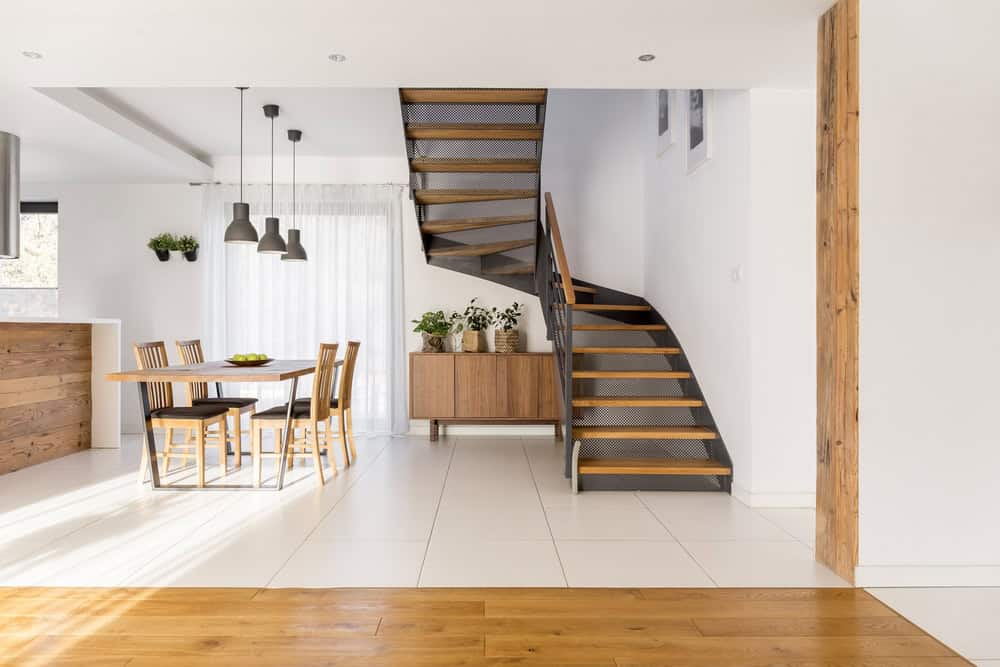 Open concept home with clean stairs and dining area